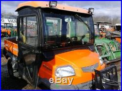 2006 RTV900W-H utility vehicle with Cab, Snow Ex 575 spreader, BOSS HD V-Plow
