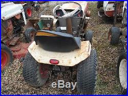 Bolens 1050 tractor with mower deck and plow blade for parts or repair
