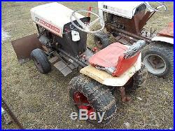 Bolens 1050 tractor with plow blade and mower deck