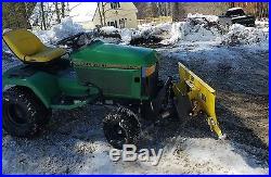 John Deere 445 garden tractor with 54 inch 4 way plow and quick hitch