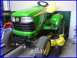 John Deere X748 Ultimate Diesel 4x4 riding lawn tractor with mower